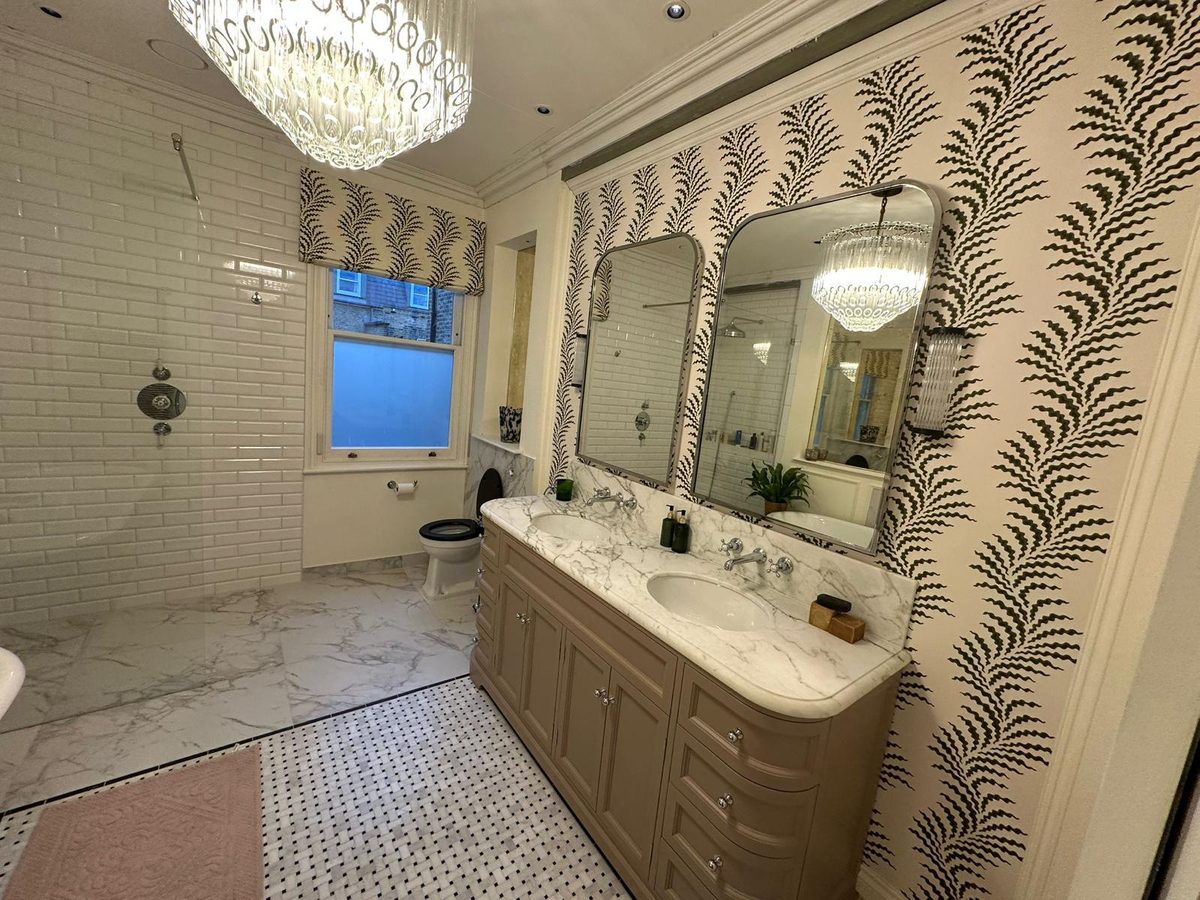 Marble vanity, mirrors and walk-in shower