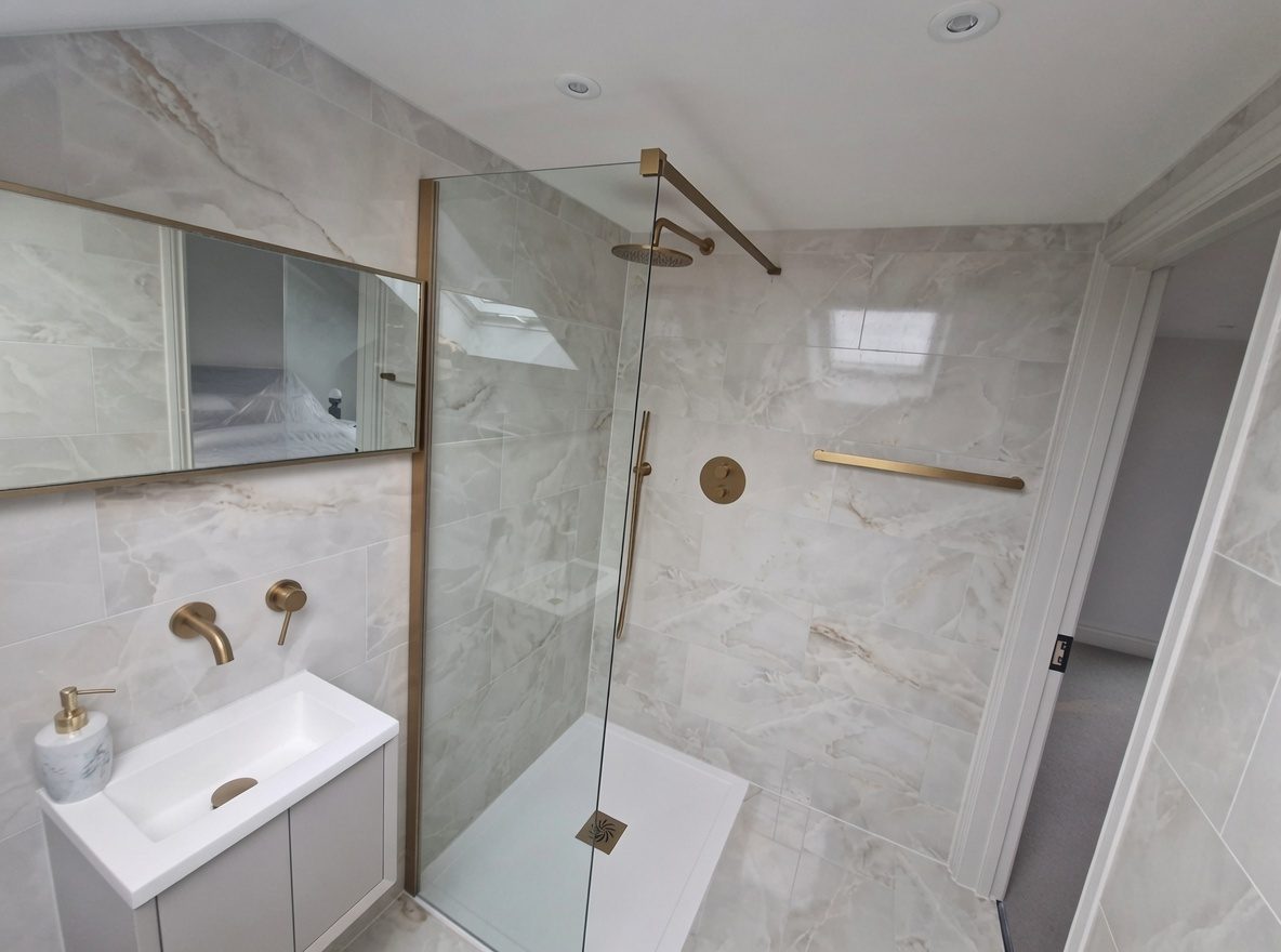 Shower enclosure and vanity with brushed-gold fittings