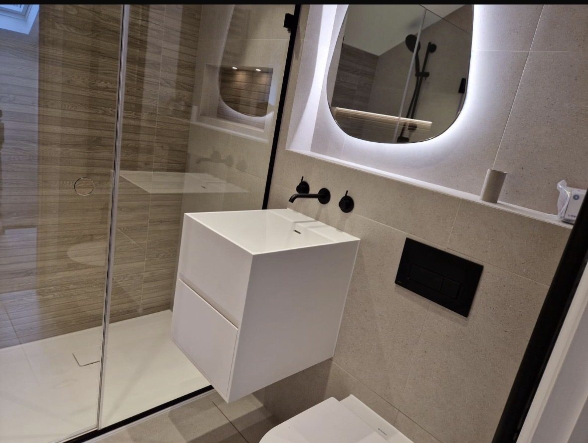 Floating vanity with LED mirror and black tap