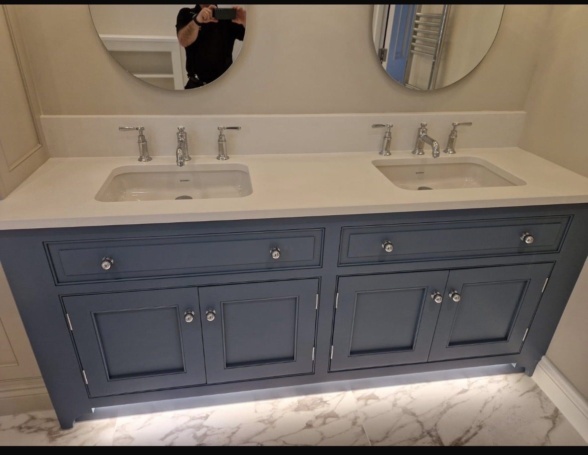 Navy double vanity with twin basins and chrome taps